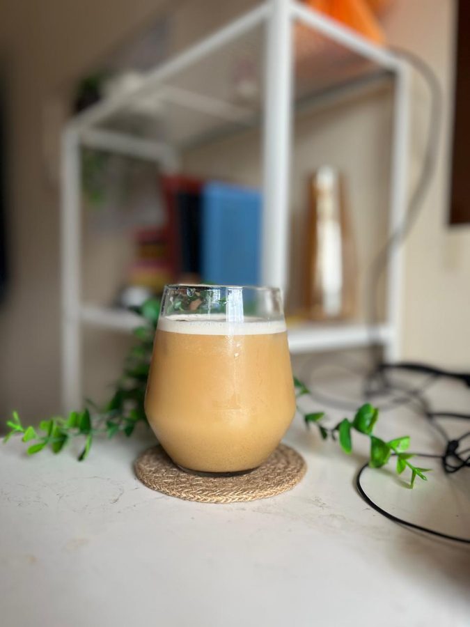 A glass of iced coffee on a coaster